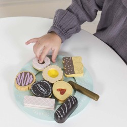 TV298-child-picking-up-a-biscuit-from-wooden-play-set.jpg