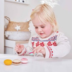 TV330-macaroons-girl-playing-with-sweet-treat.jpg